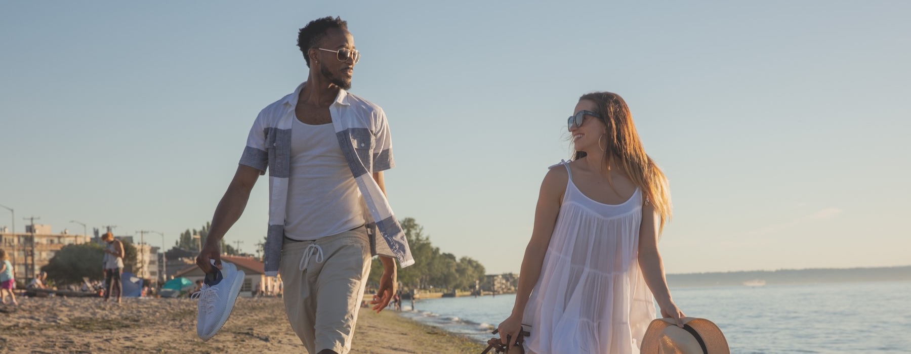a man and a woman walking on a beach