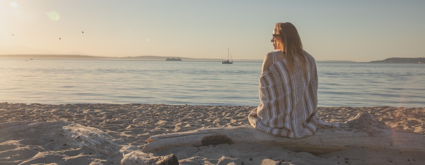 a person sitting on a beach