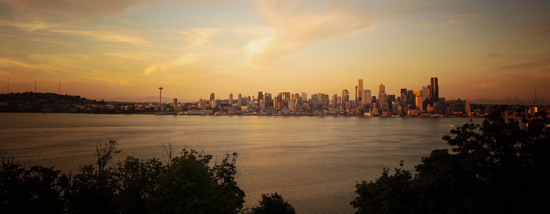 a city skyline across a body of water