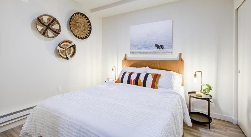 a bed with a white bed spread