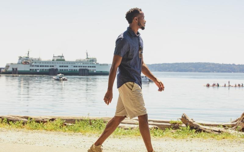 a man walking on a beach