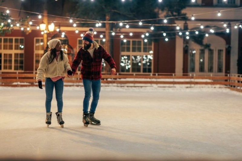 a man and a woman ice skating