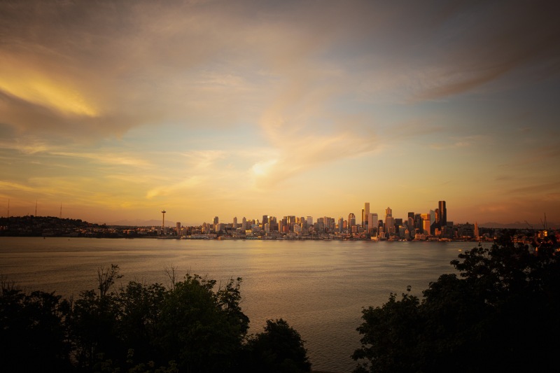 a city skyline across a body of water