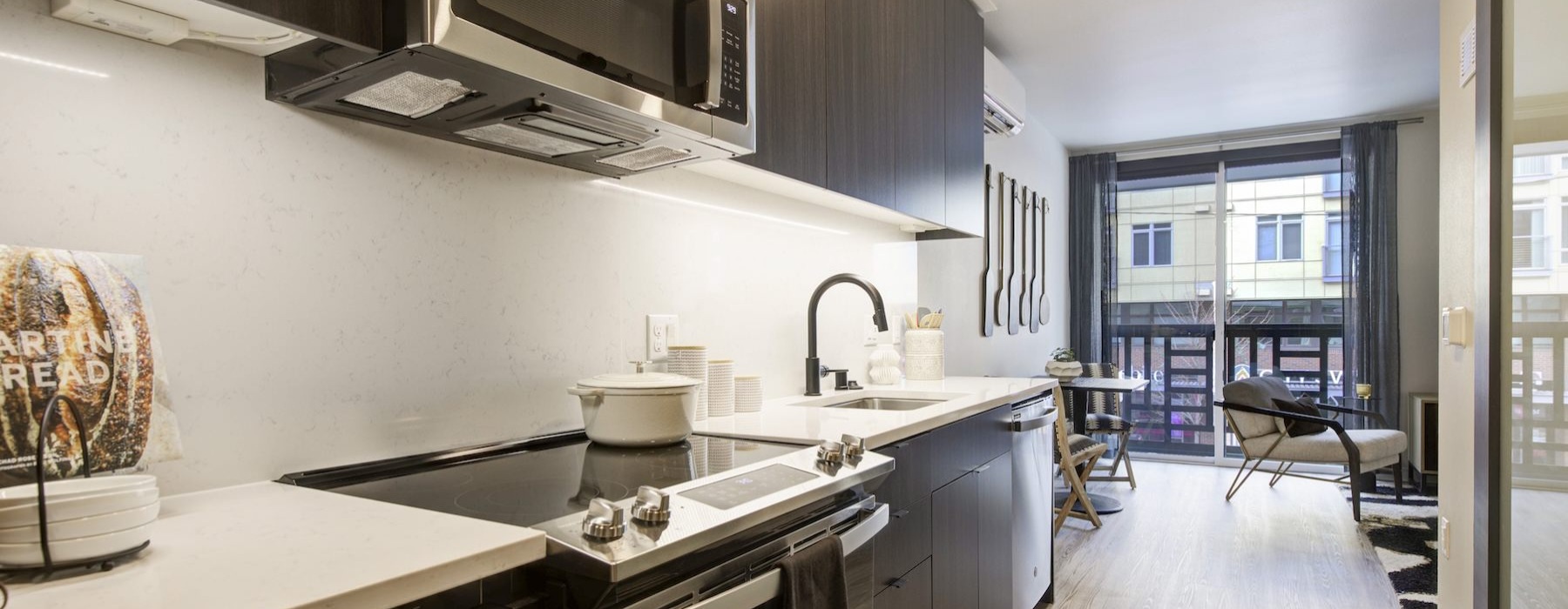 a kitchen with black appliances