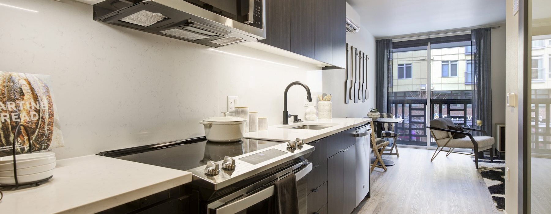 a kitchen with black appliances