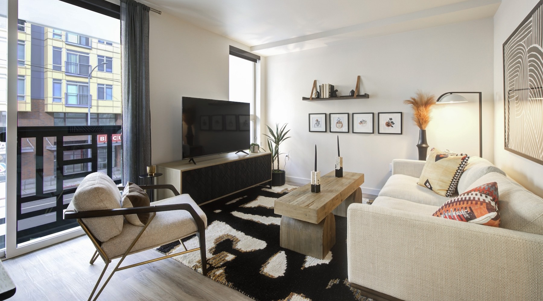 a living room with a couch, tv and coffee table