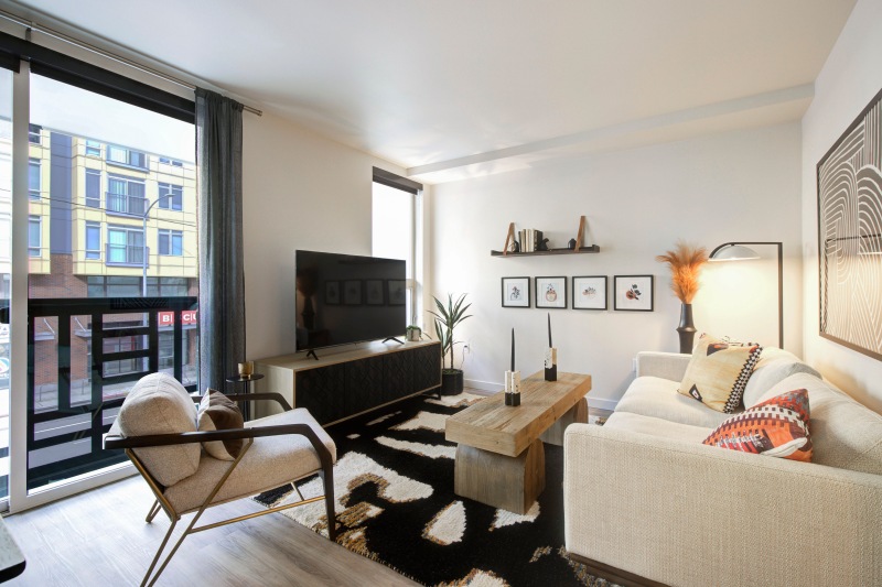 a living room with a tv and couches