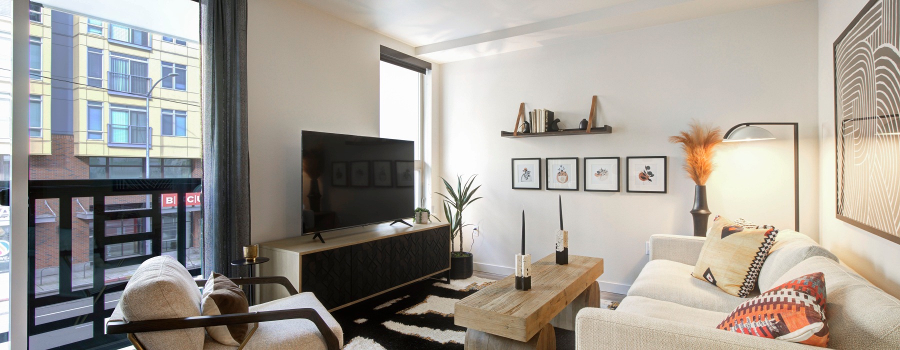 a living room with a tv and couches