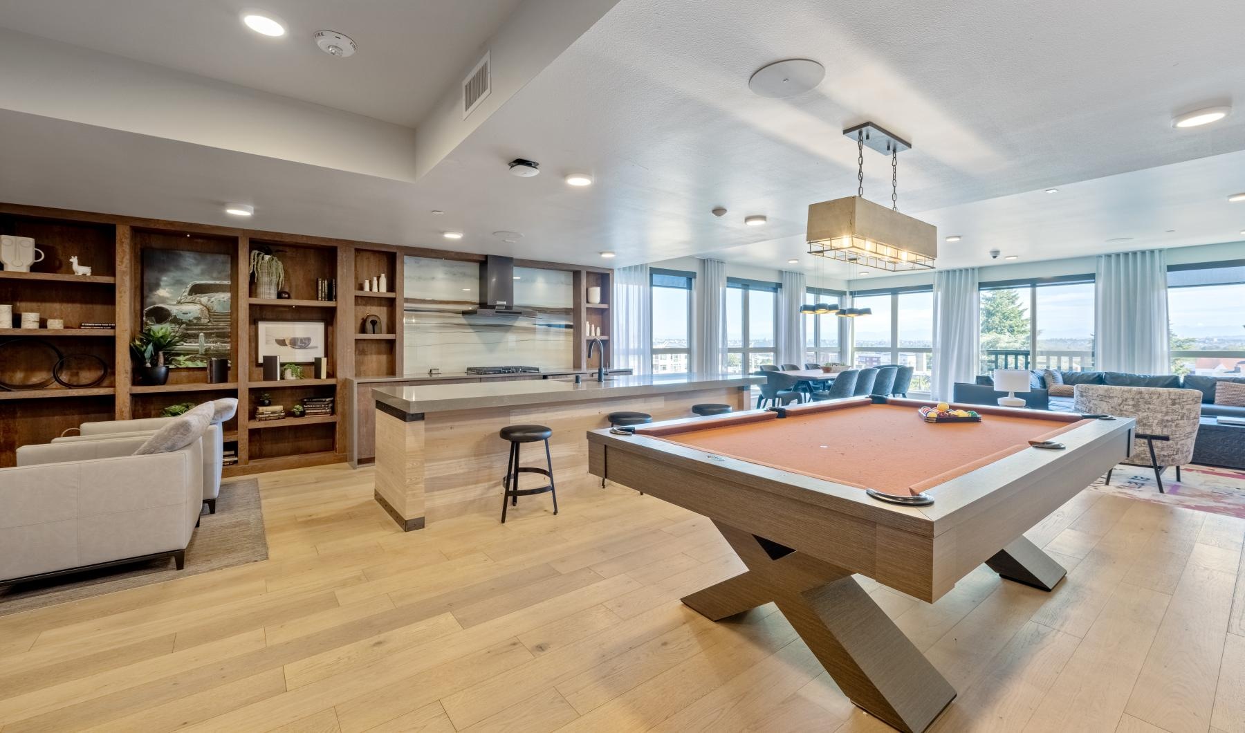 a clubroom with a pool table and a couch