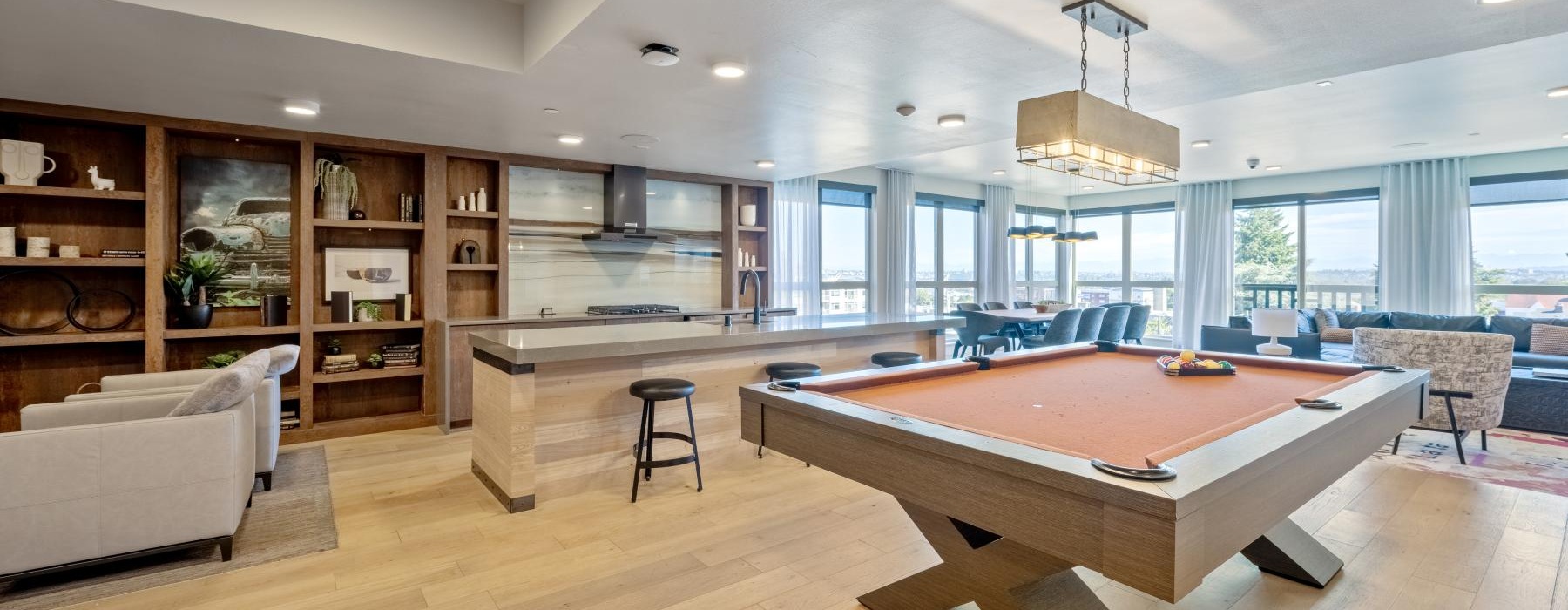 a clubroom with a pool table and a couch