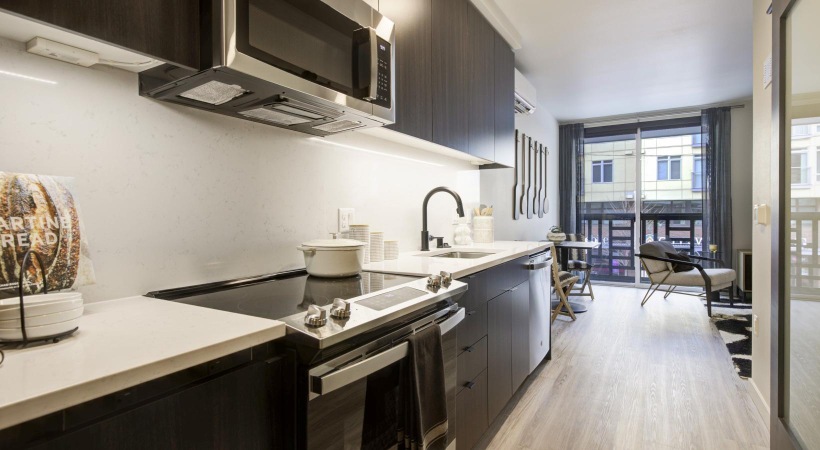 a kitchen with black appliances