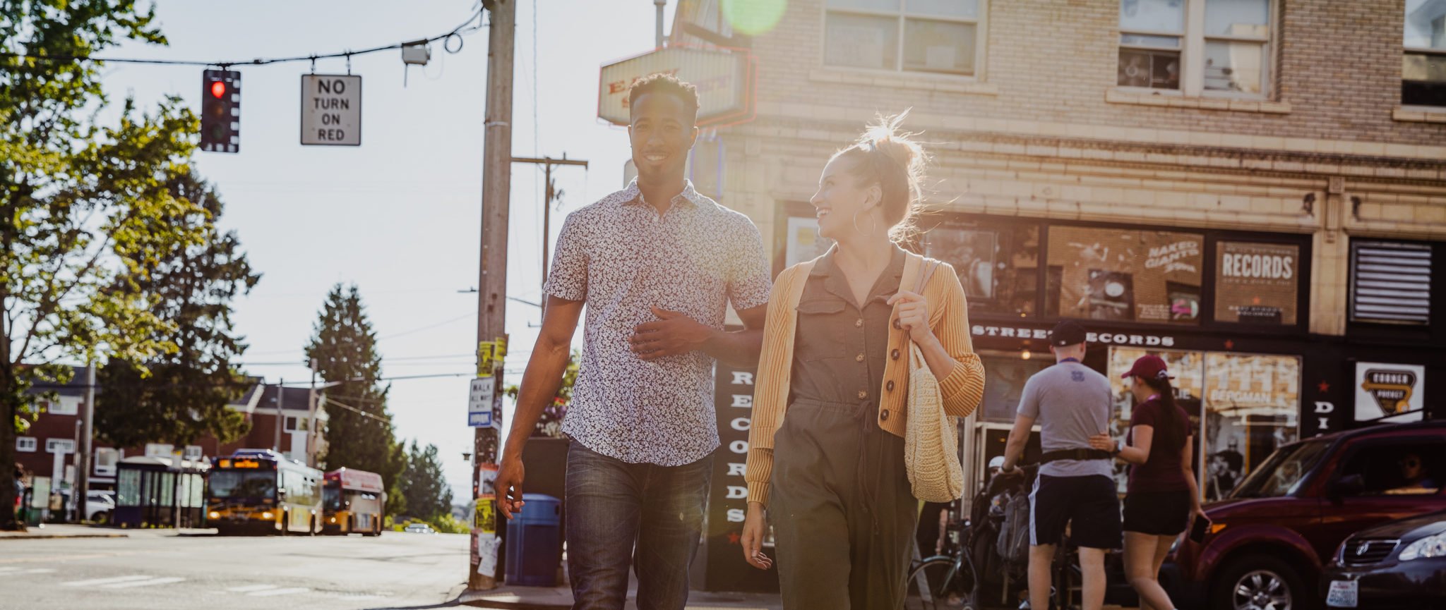 Maris Seattle couple crossing a neighborhood street