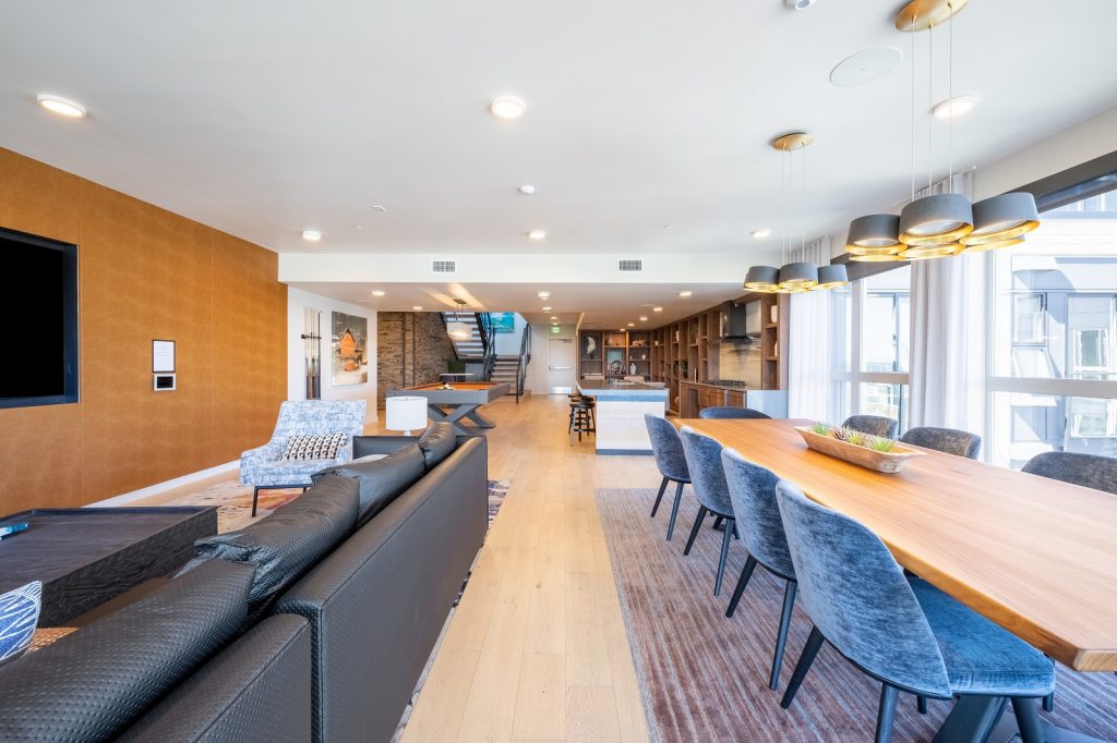 interior view long table and tv watching area