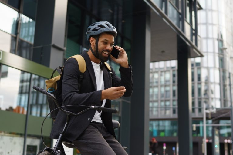 city commuter speaking on the phone after work